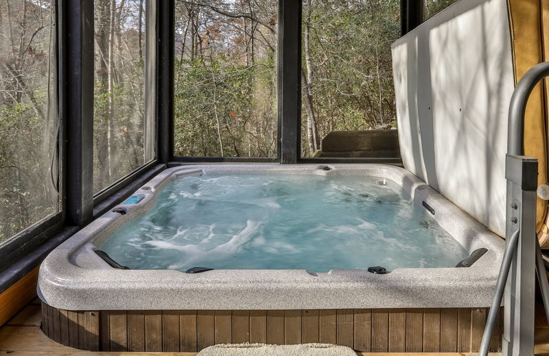 Cabin hot tub at Mountain Oasis Cabin Rentals.