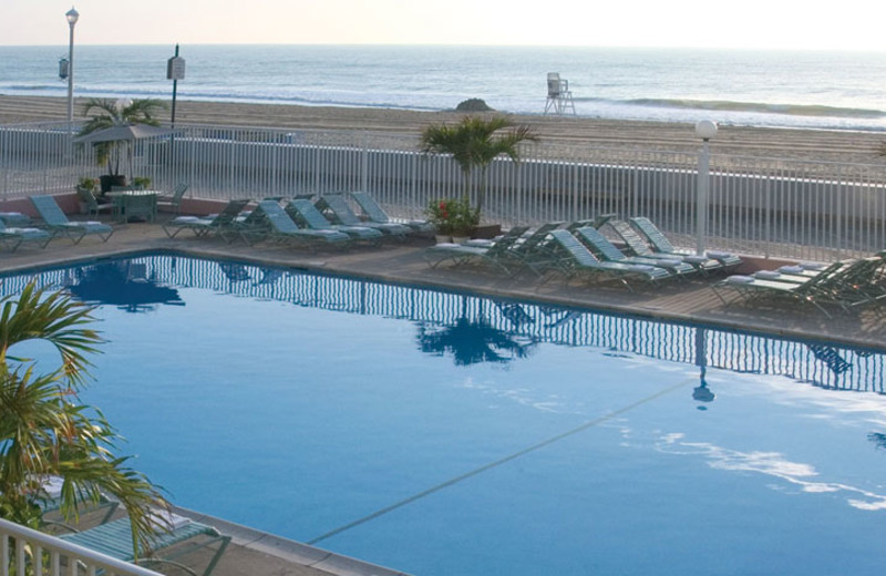Outdoor pool with beach view at Quality Inn Boardwalk Ocean City.