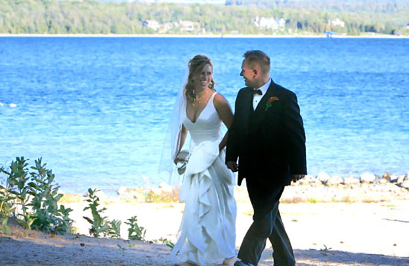 Wedding couple by the lake at Edgewater Inn on the Harbor.