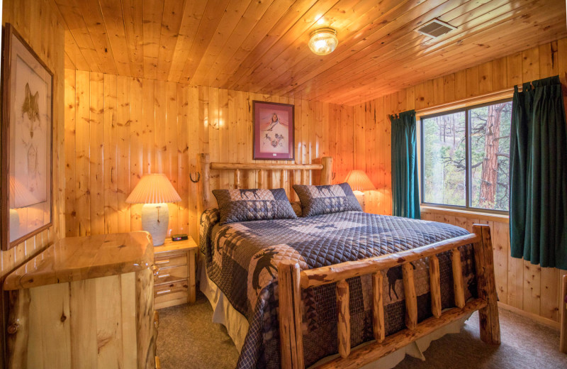 Cabin bedroom at Pine River Lodge.