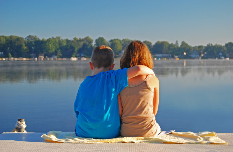 Kids by lake near Perham Oasis Travel Plaza.
