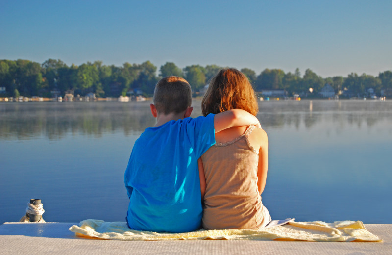 Kids by lake near Perham Oasis Travel Plaza.