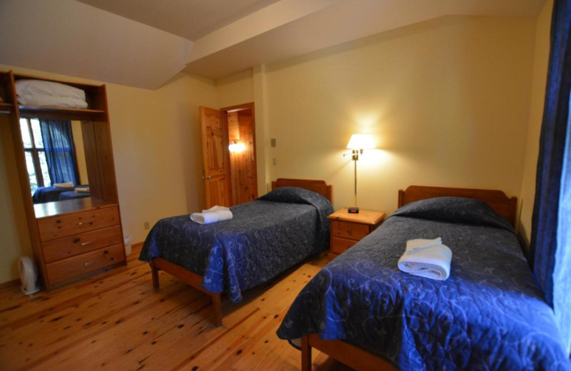 Cottage bedroom at Port Cunnington Lodge & Resort.