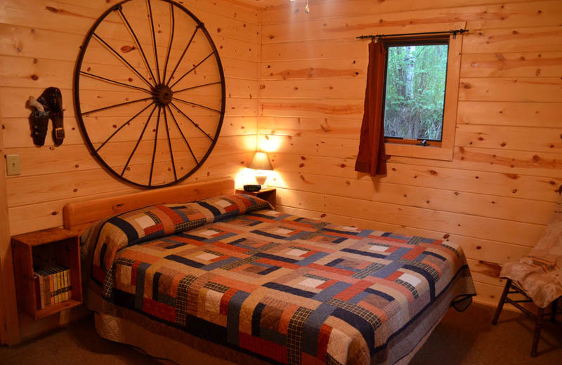 Cabin bedroom at Backroads Inn and Cabins.