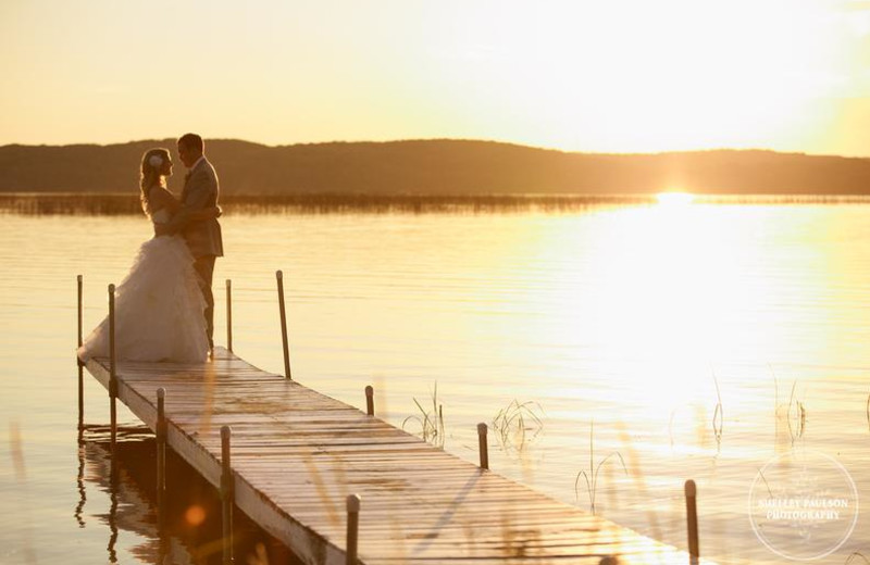 Wedding couple on dock at Madden's on Gull Lake.