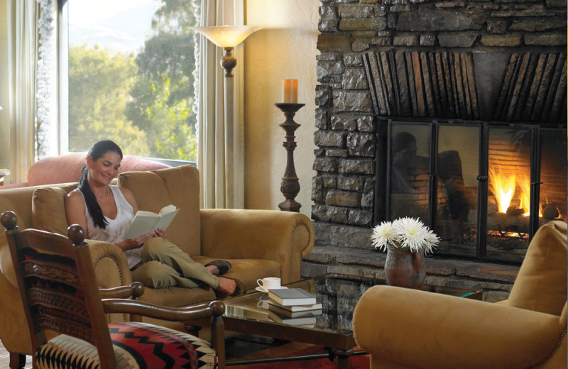 Relaxing by the fireplace at Canyon Ranch Tucson.