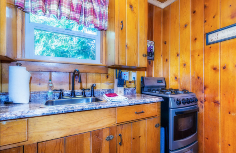 Cabin kitchen at Knotty Pine Cabins.