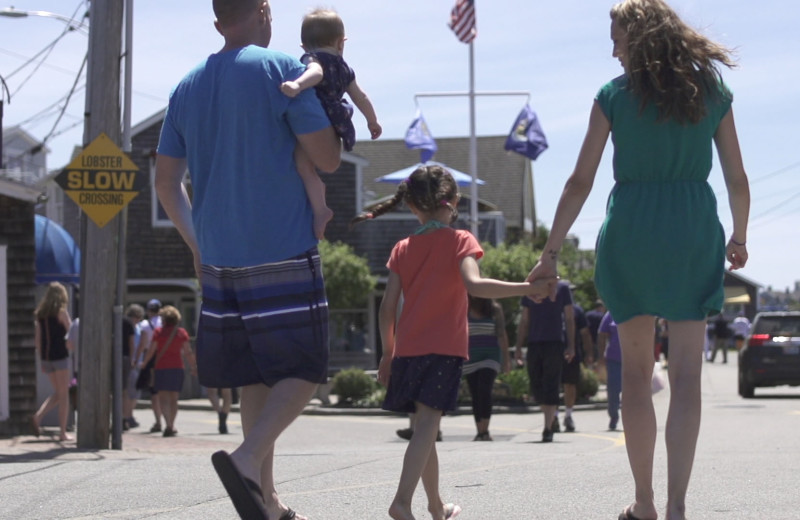 Family walking through town near The Meadowmere Resort.