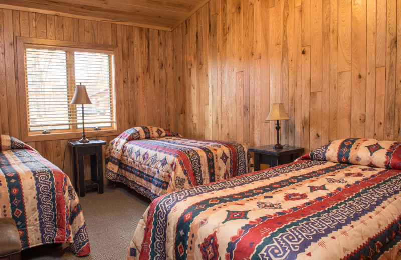 Cabin bedroom at Hiawatha Beach Resort.