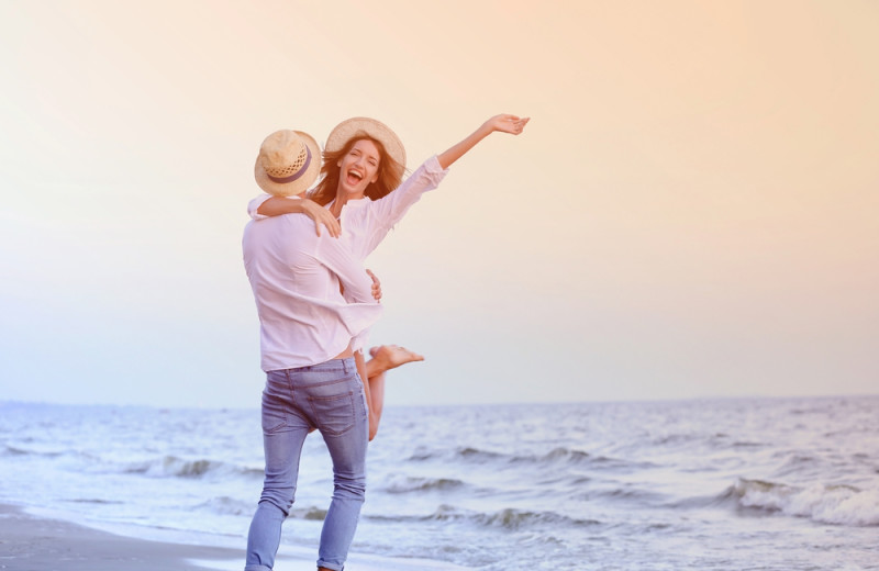 Couple on beach at Boardwalk Plaza Hotel.