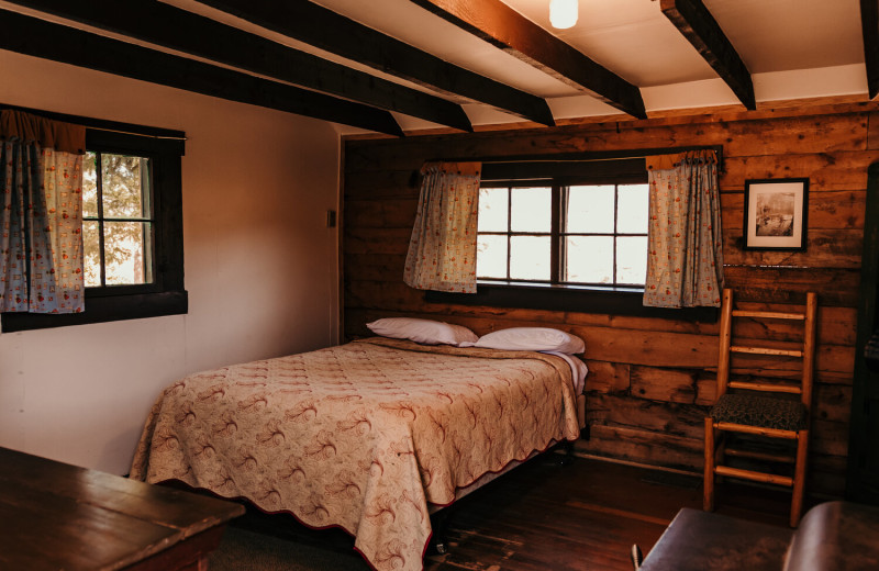 Cabin bed at Trappers Lake Lodge & Resort.