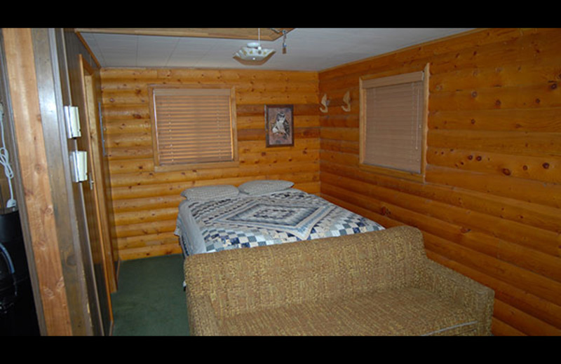 Cabin bedroom at Sourdough Lodge.