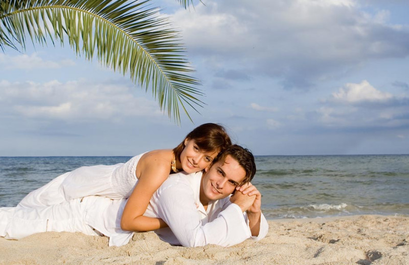 Couple on the beach at Gulf Strand Resort.