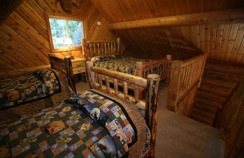 Cabin bedroom at Western Pleasure Guest Ranch.