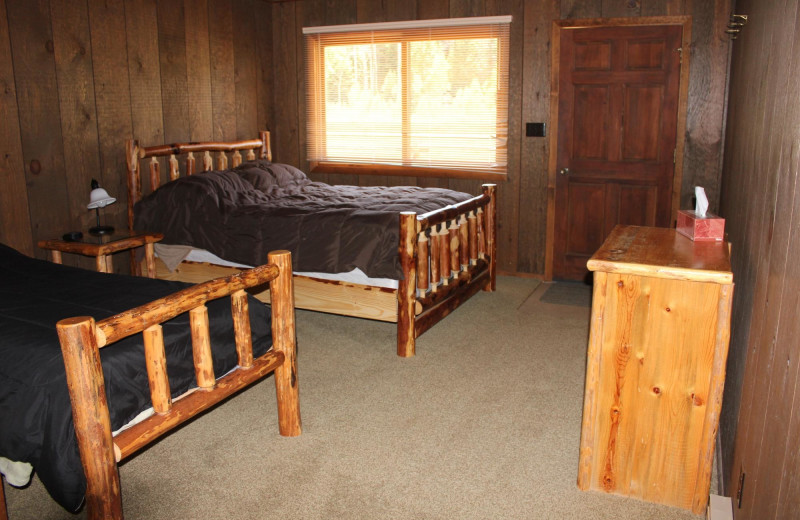 Cabin bedroom at Kendall Valley Lodge.