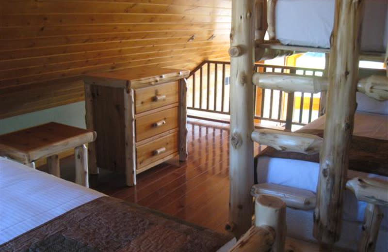 A perfect space for a family or siblings to sleep upstairs with a full size bed and twin bunk beds.