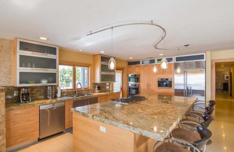 Rental kitchen at Sun Palace Vacation Rentals.