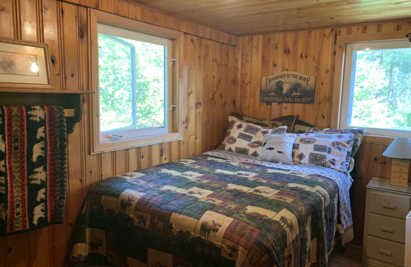 Cabin bedroom at Dogtooth Lake Resort.