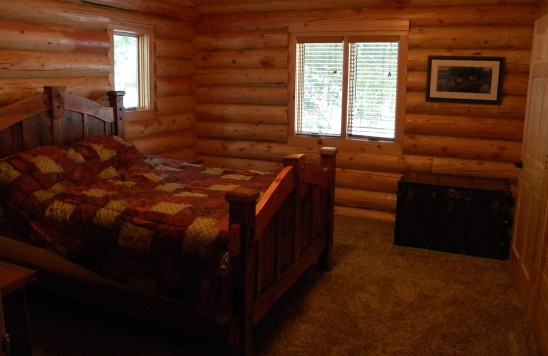 Cabin bedroom at Crane Lake Wilderness Lodge.