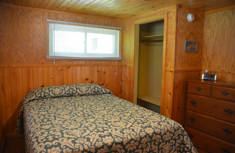 Cottage bedroom at Channel Waterfront Cottages.