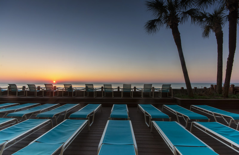 Relaxing on beach chairs at Water's Edge Resort.