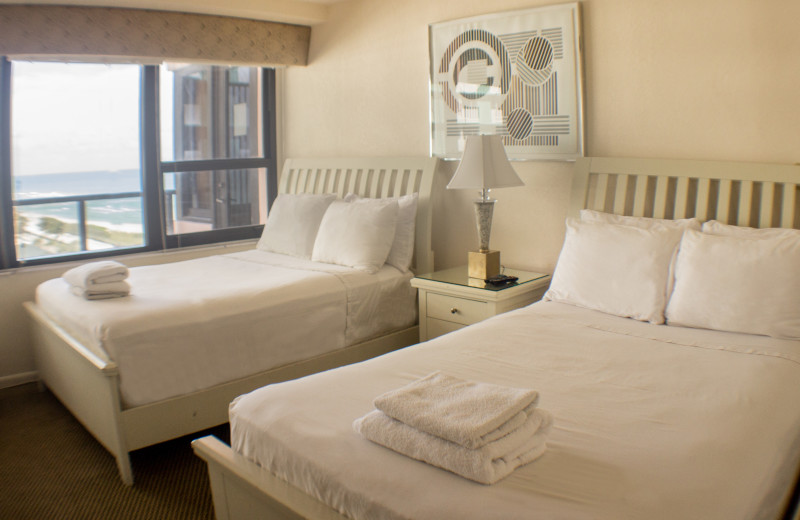 Guest bedroom at The Alexander All Suite Oceanfront Resort.