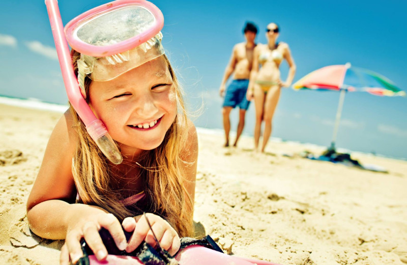 Family on the beach at Gold Key Resorts.