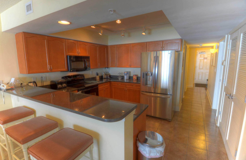 Rental kitchen at CondoLux Vacation Rentals.