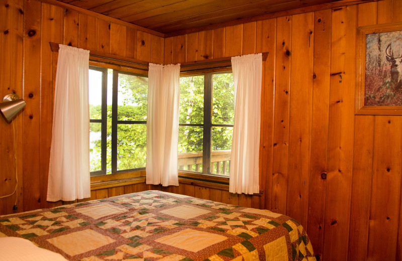 Cabin bedroom at Woodland Beach Resort.