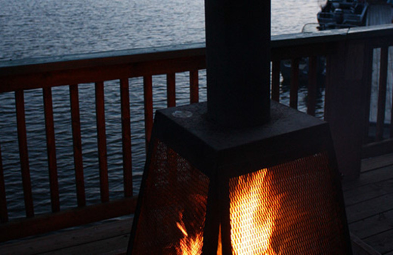 Deck fireplace at Shady Roost Lodge.