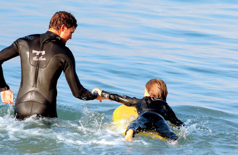 Family surfing at The Ritz-Carlton, Laguna Niguel.