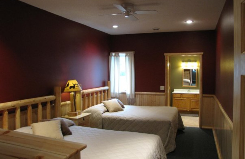 Cabin bedroom at Auger's Pine View Resort.