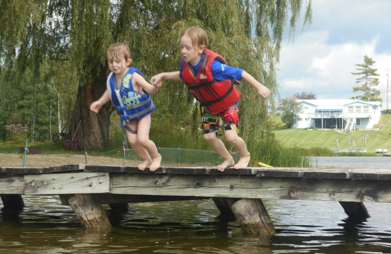 Jumping in lake at Lake George Resort.