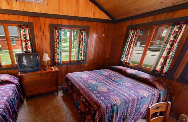 Cabin bedroom at Hiawatha Beach Resort.