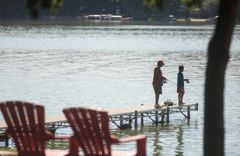 Fishing on dock at Delton Oaks Resort.