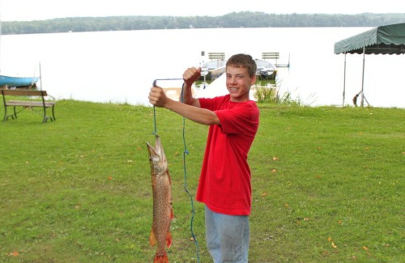 Kid With Big Catch at Janetski's Big Chetac Resort 