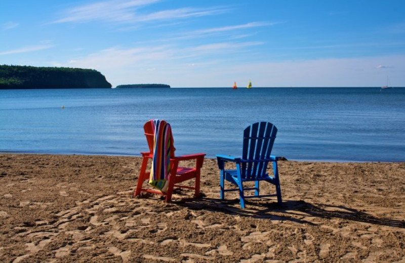 Chairs on the beach at Bay Breeze Resort.