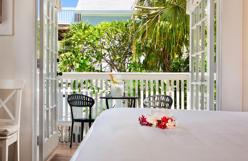 Guest bedroom with balcony at Southernmost Inn.