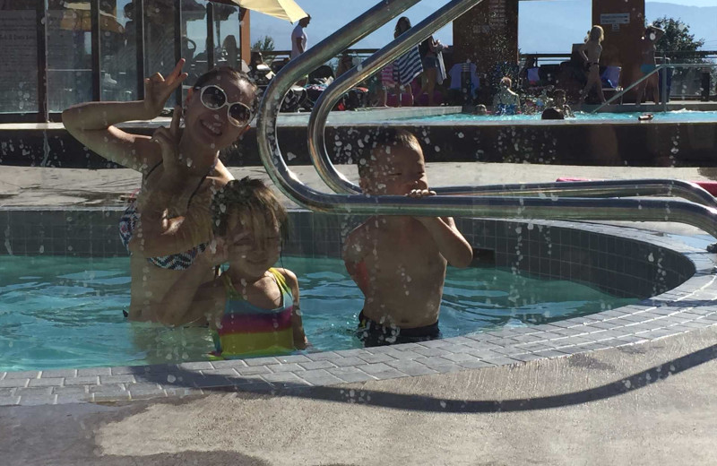 Kids in pool at realTopia Vacation Rentals.