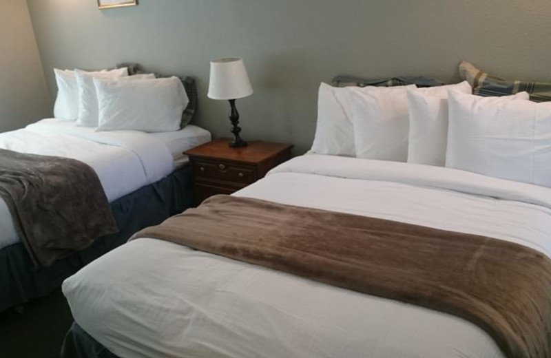 Cabin bedroom at Long Barn Lodge.