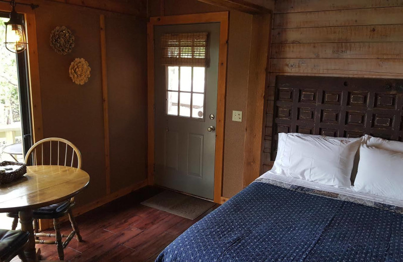 Cabin bedroom at Arkansas White River Cabins.