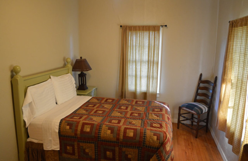 Cabin bedroom at Mulberry Mountain Lodging & Events.