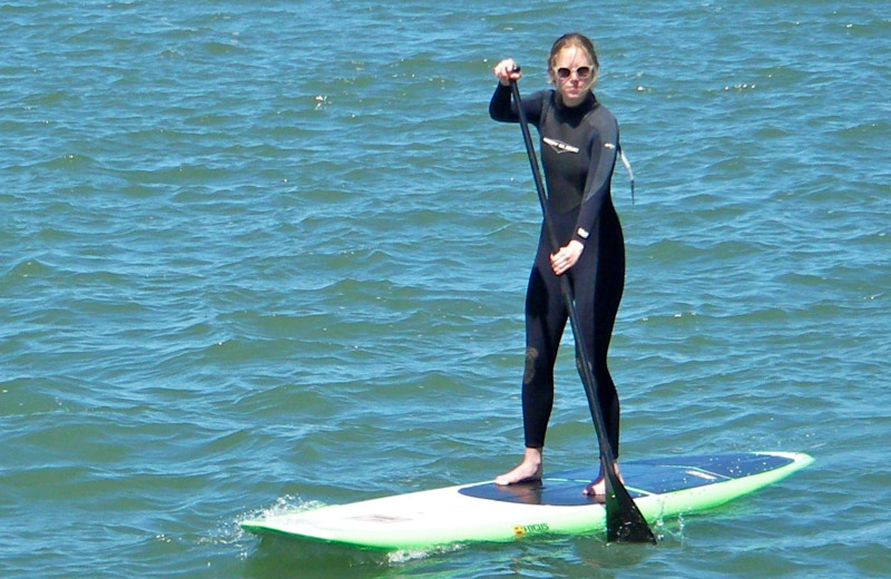 Paddle boarding at Beach House Half Moon Bay.