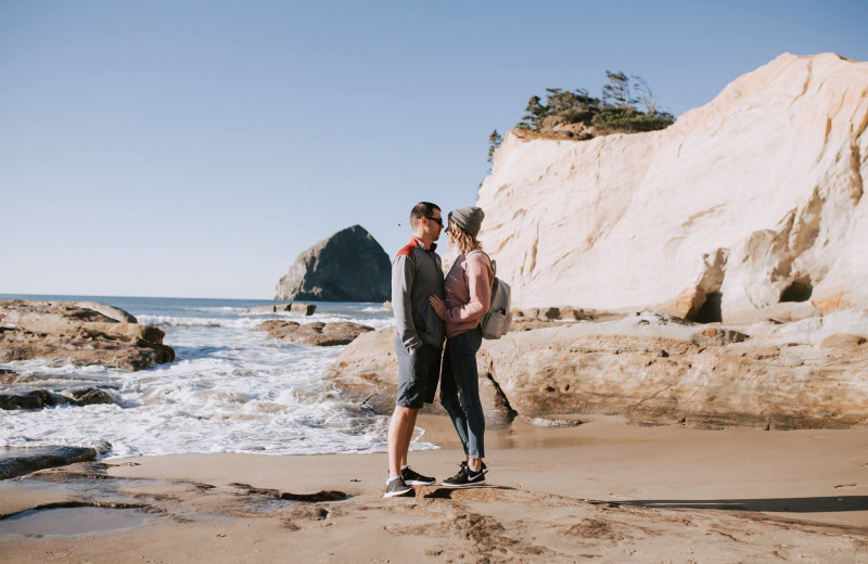 Couple on beach at Inn at Cape Kiwanda.