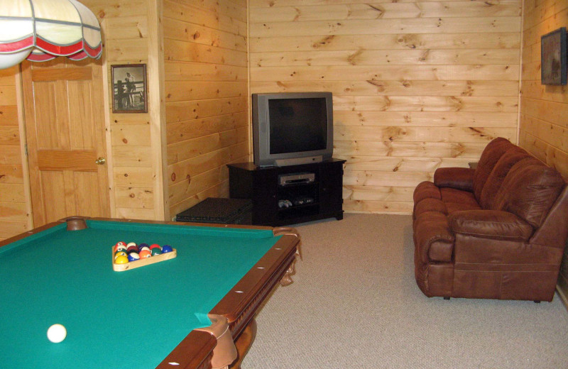 Billiards table living room at Black Bear Cabin Rentals.