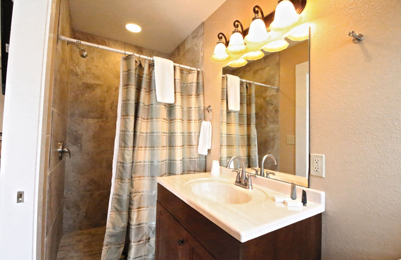 Guest bathroom at Peach Tree Inn & Suites.