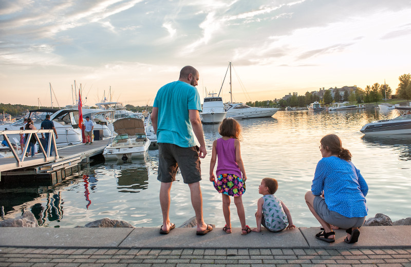 Family on dock at Bay Harbor Village Hotel & Conference Center.