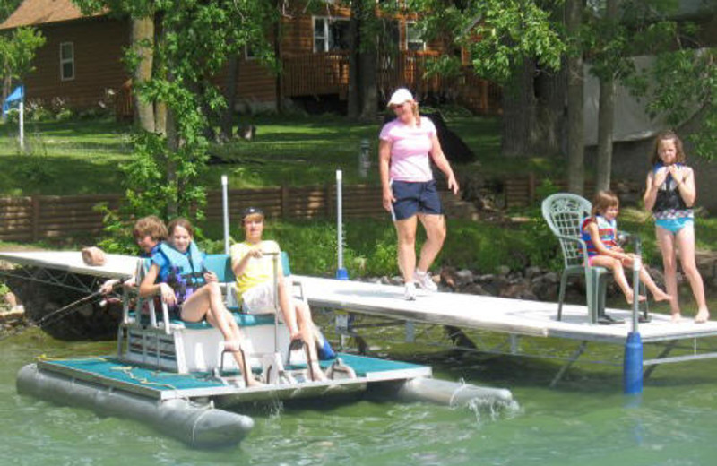 Family On Lake Dock at Janetski's Big Chetac Resort 