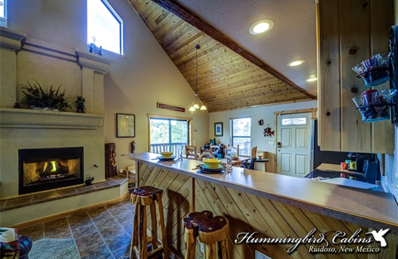 Dining and kitchen area at Hummingbird Cabins - Chatty Chipmunk Vacation Rental