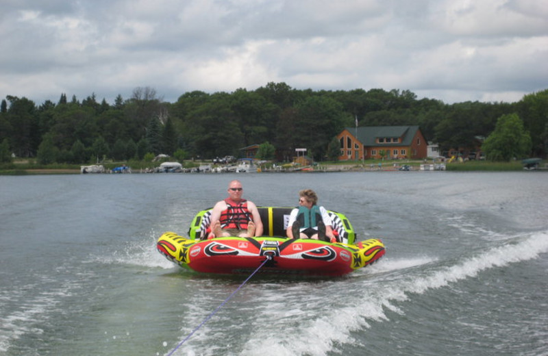 Tubing on lake at Cozy Bay Resort.